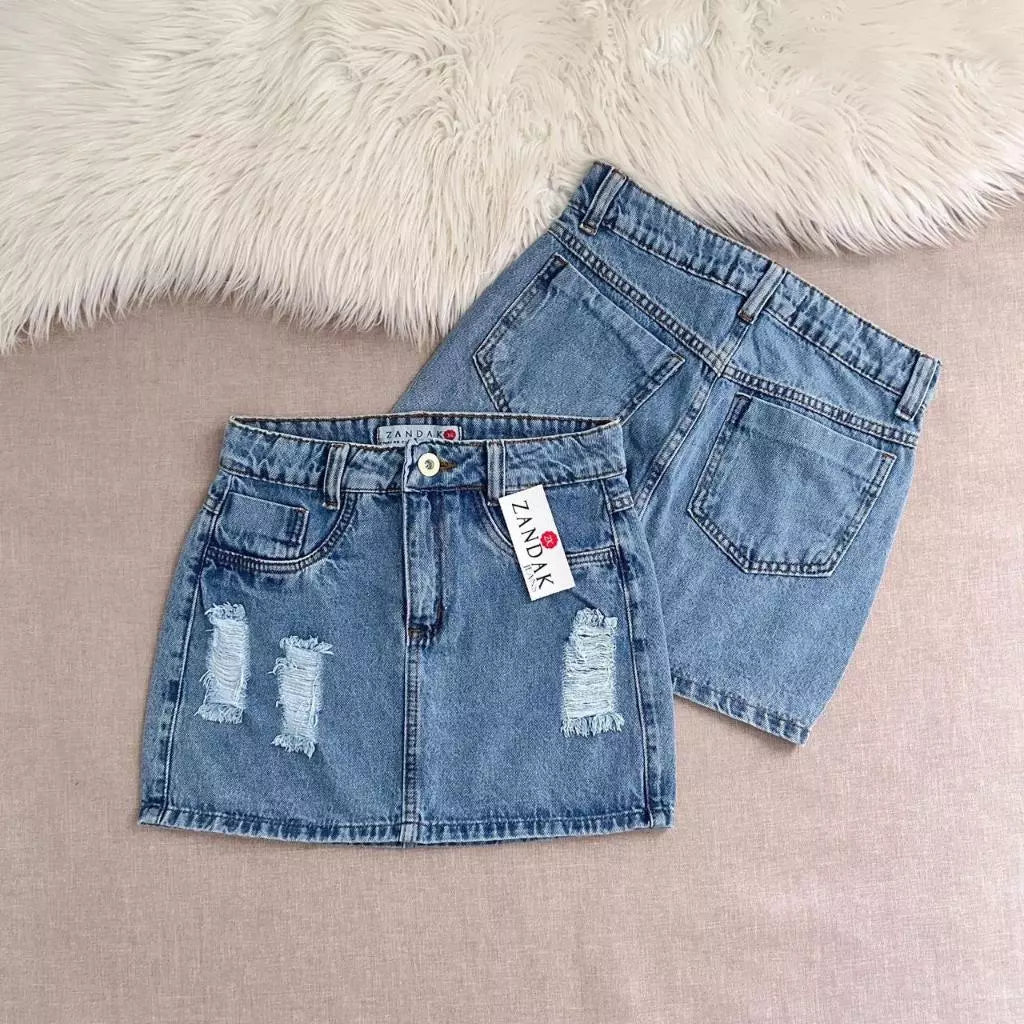 Saia jeans feminina azul manchada Rasgada
