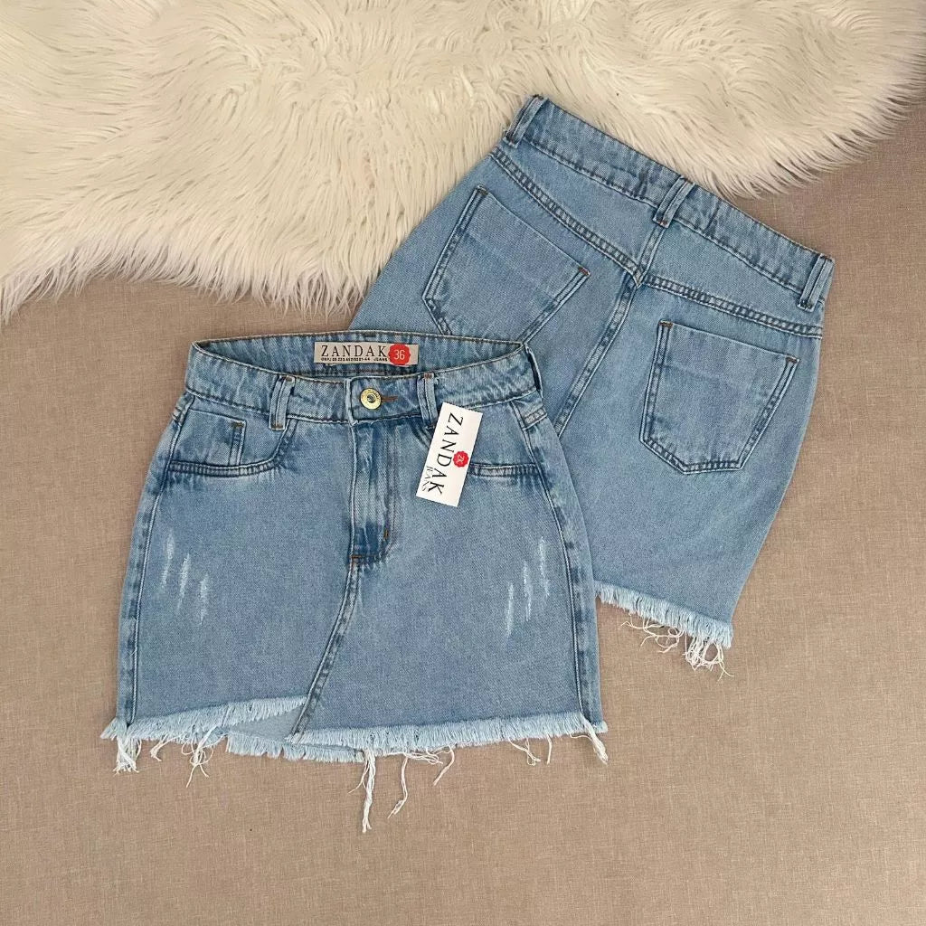 Saia jeans feminina azul manchada Rasgada